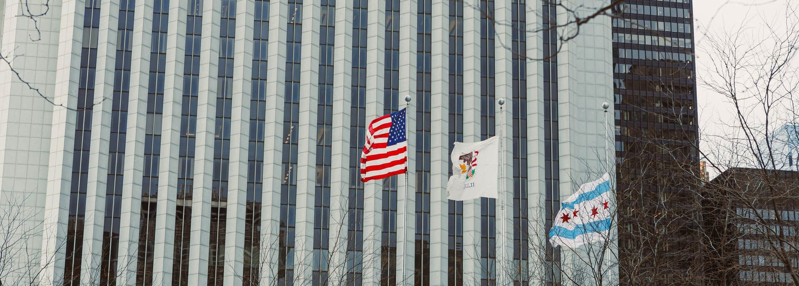 McKinney commercial property Downtown McKinney commercial building flying the United States, Texas and McKinney flags